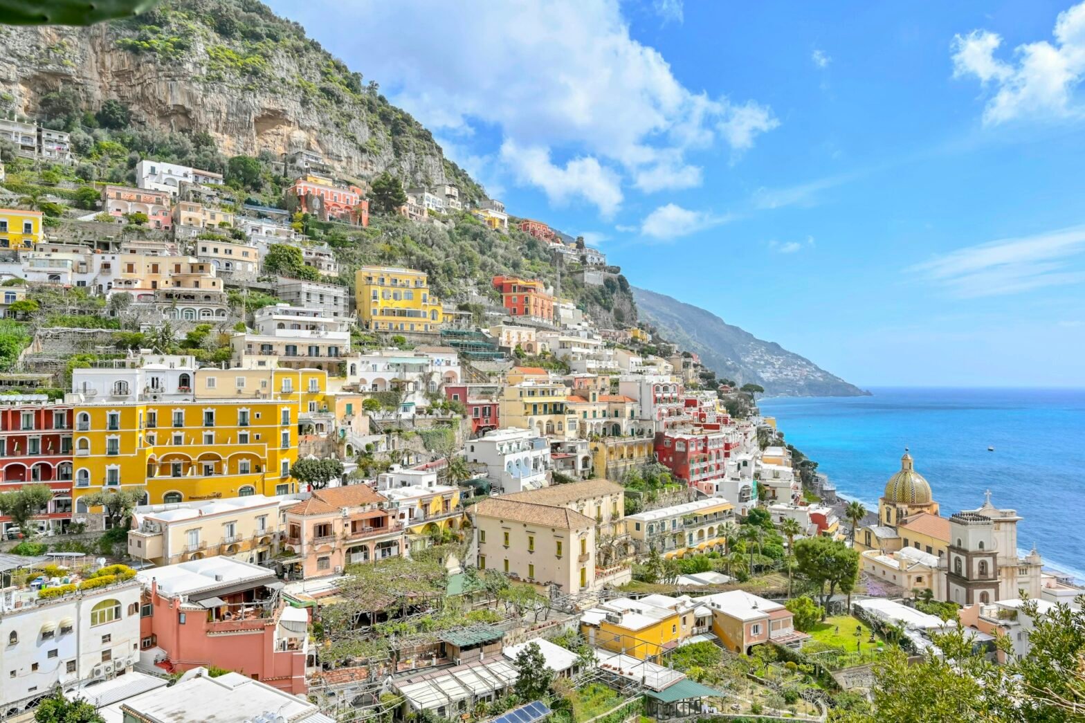 Colorful houses cascading down the hillside of Positano above the Mediterranean Sea on the Amalfi Coast