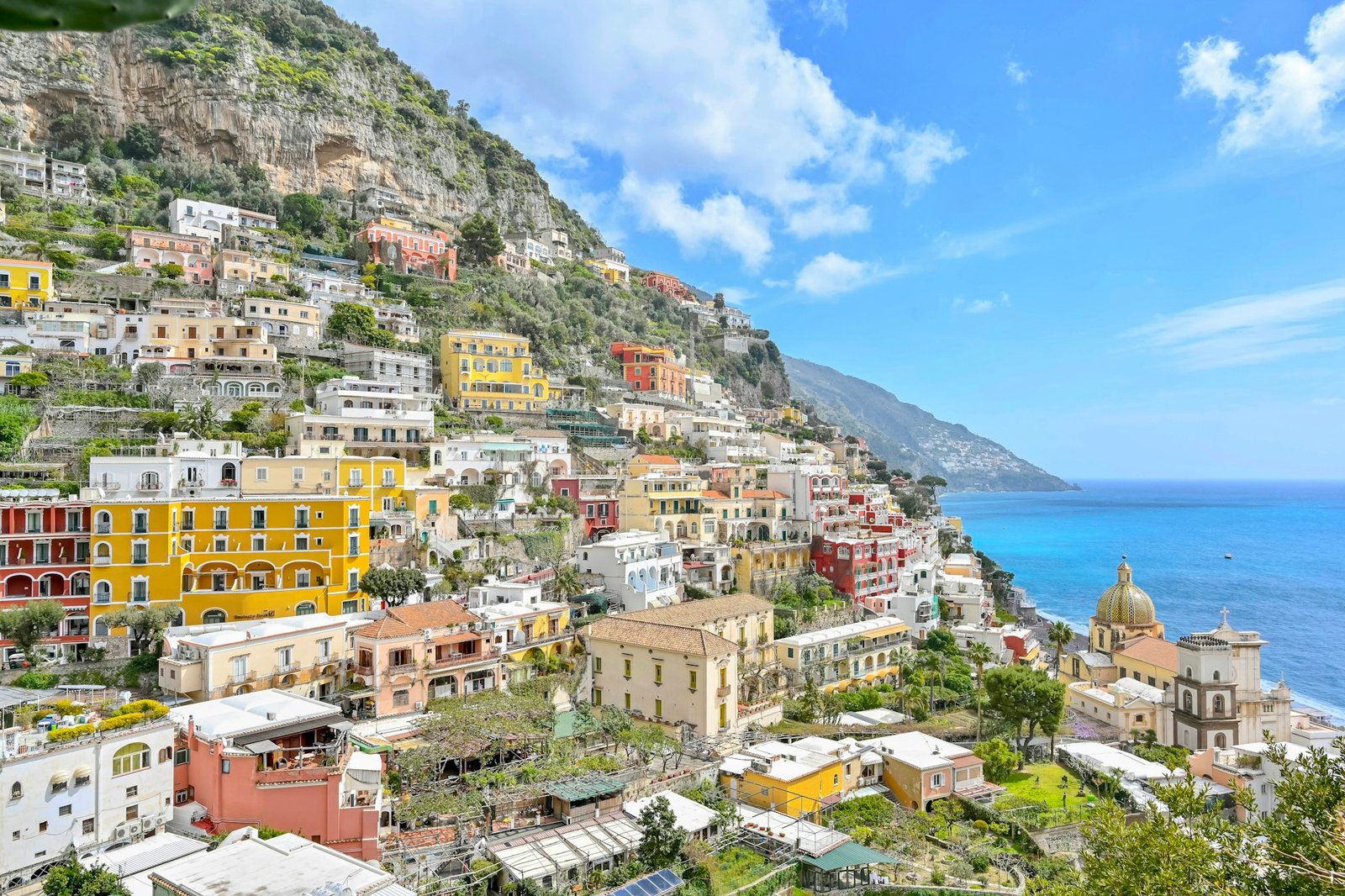 Colorful houses cascading down the hillside of Positano above the Mediterranean Sea on the Amalfi Coast